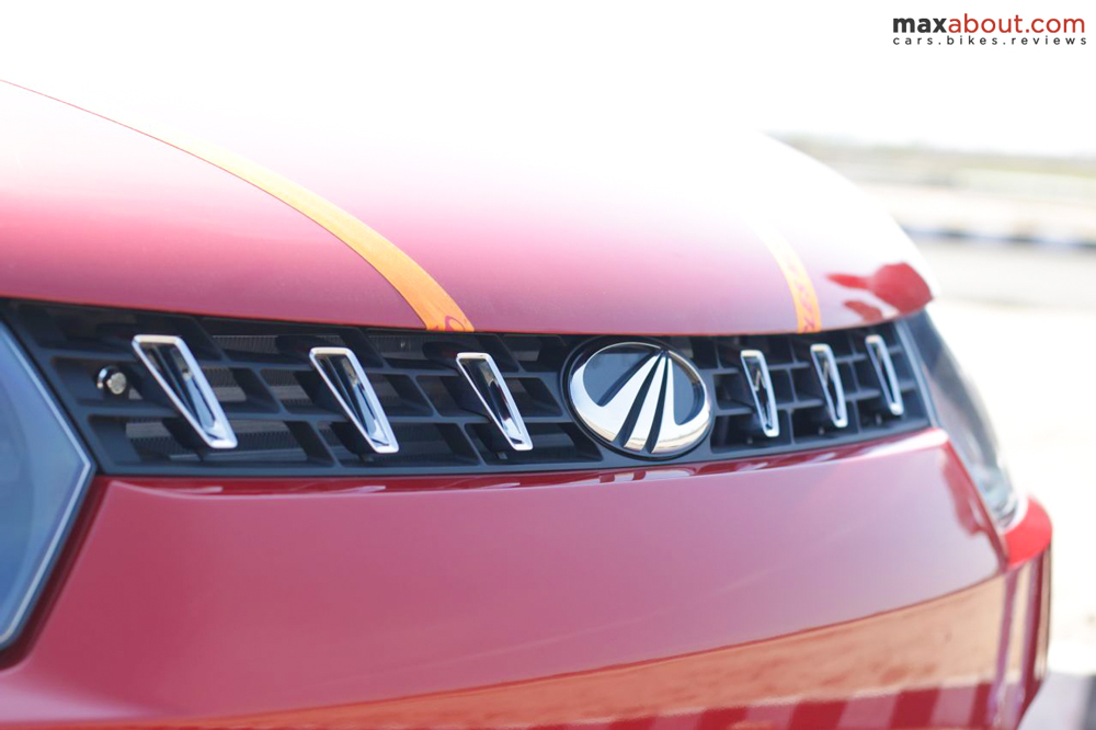  The typical Mahindra grill has been placed here with the smallest ever slats on the KUV100. They are finished in chrome and houses the company logo in the middle.