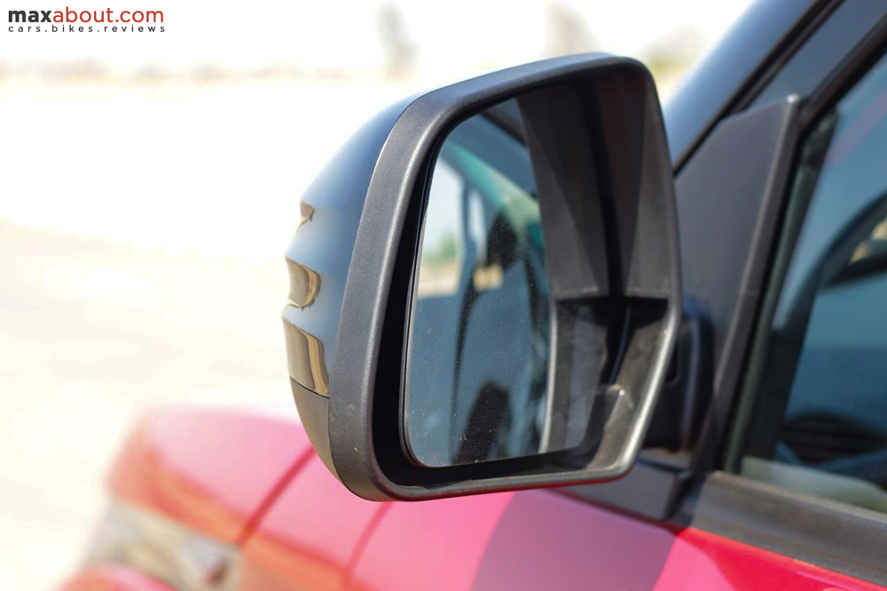 Rear view mirrors are electronically adjustable on the dual tone KUV100.