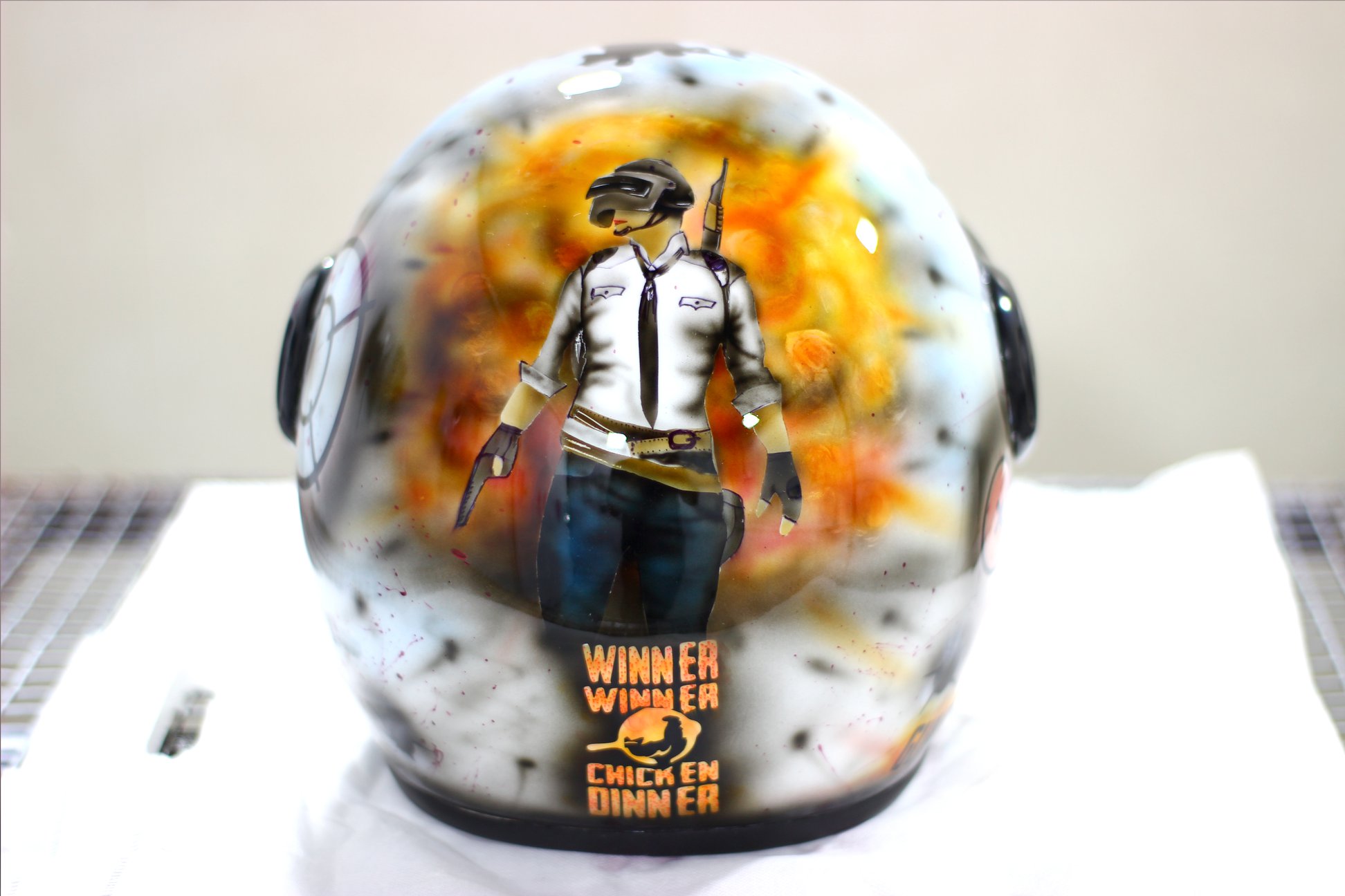 'Winner Winner Chicken Dinner' Hand-Painted PUBG Helmet by 'Guns and Hoses' - photograph